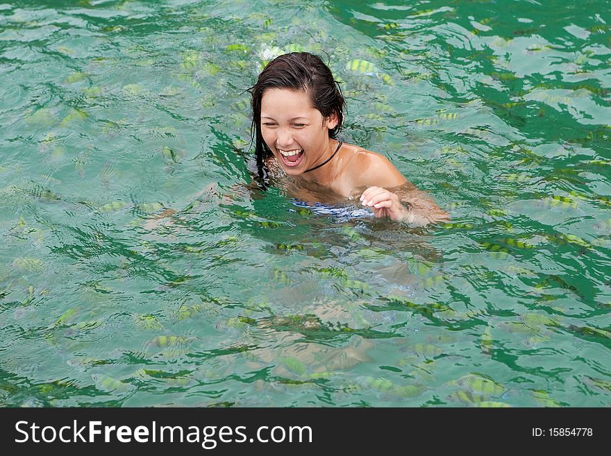 Girl Swims With Tropical Fish