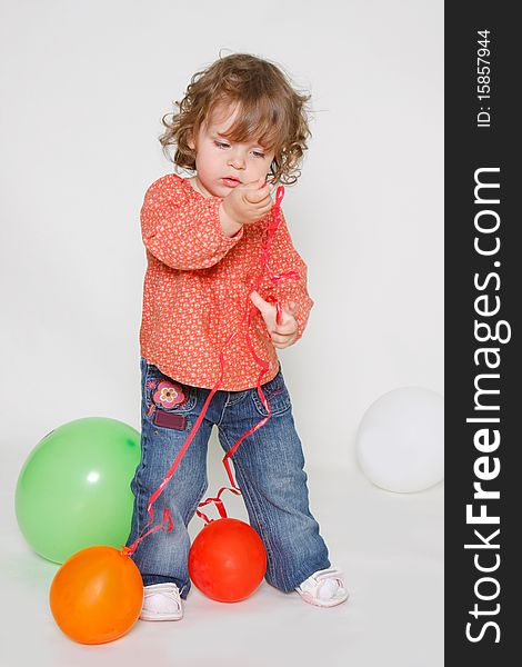 Little Girl Playing With Colorful Balloons