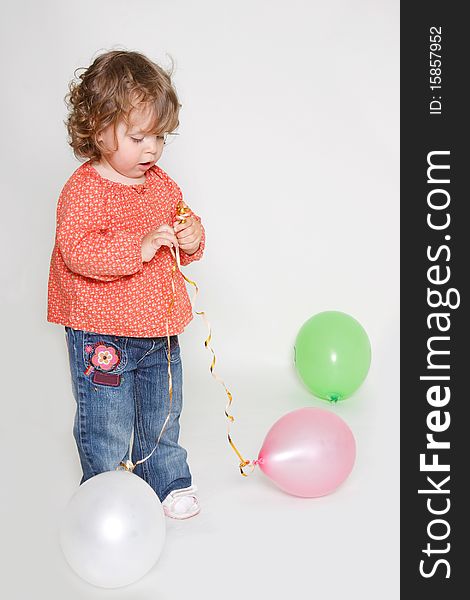 Little Girl Playing With Colorful Balloons