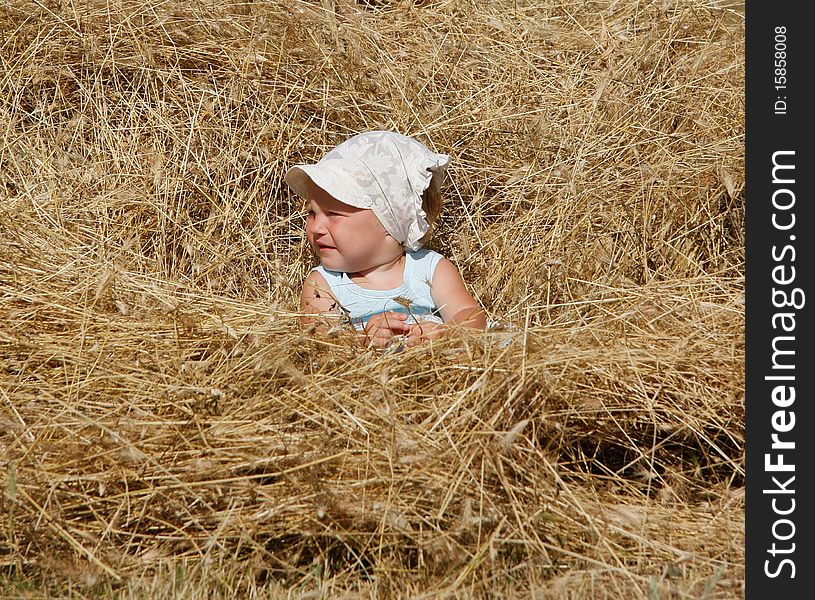 Little girl in hay