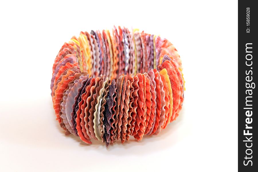 A multicolored seashell bracelet isolated on a white background.
