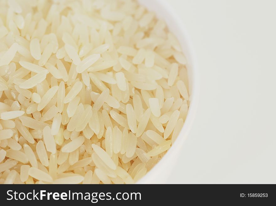 Rice in white bowl and white background