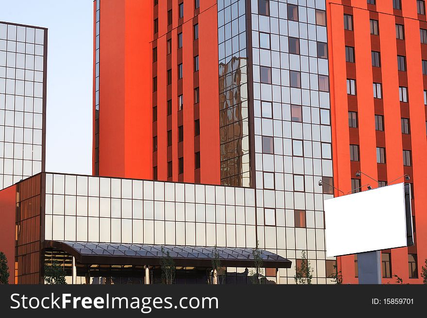 Office building with mirror windows and warm color