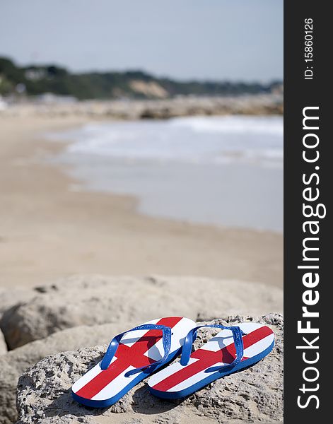 England flip flops on a British beach. England flip flops on a British beach
