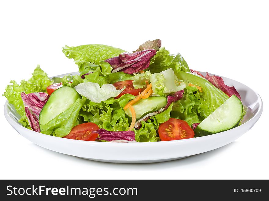 Salad with vegetables on white background