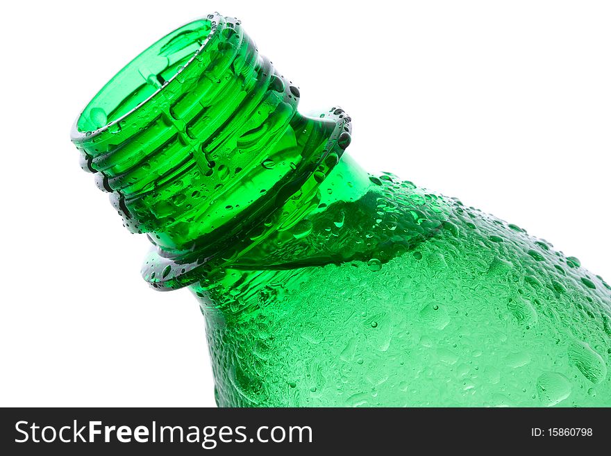 Plastic bottle with water drops on white background