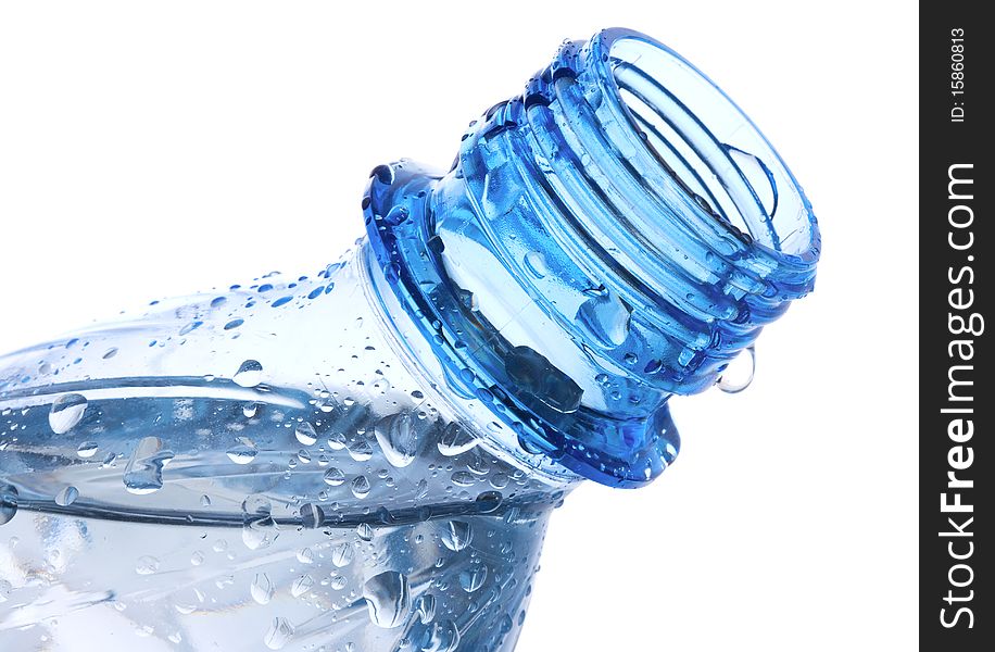 Plastic bottle with waterdrops on white background