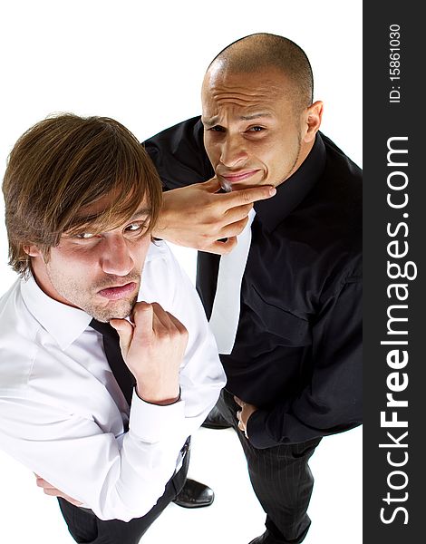 Two young funny businessmen over isolated white background acting goofey. Two young funny businessmen over isolated white background acting goofey.