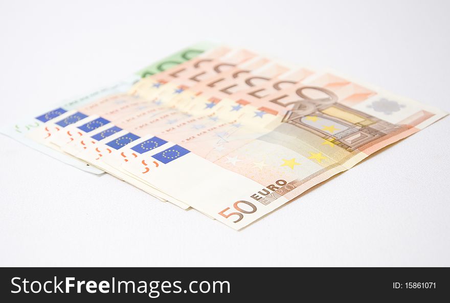 Euro bills on a white background