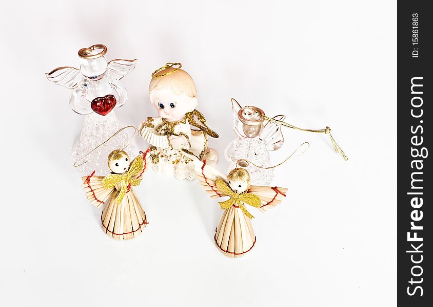 Various Glass And Straw Angels Figures Isolated