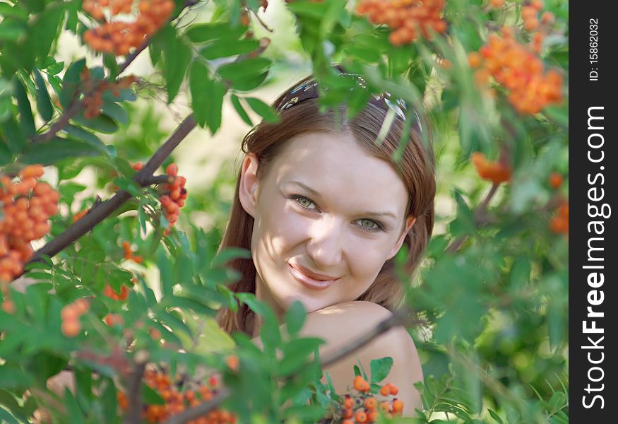 Beautiful girl in the forest with mountain ash. Shallow DOF. Beautiful girl in the forest with mountain ash. Shallow DOF.