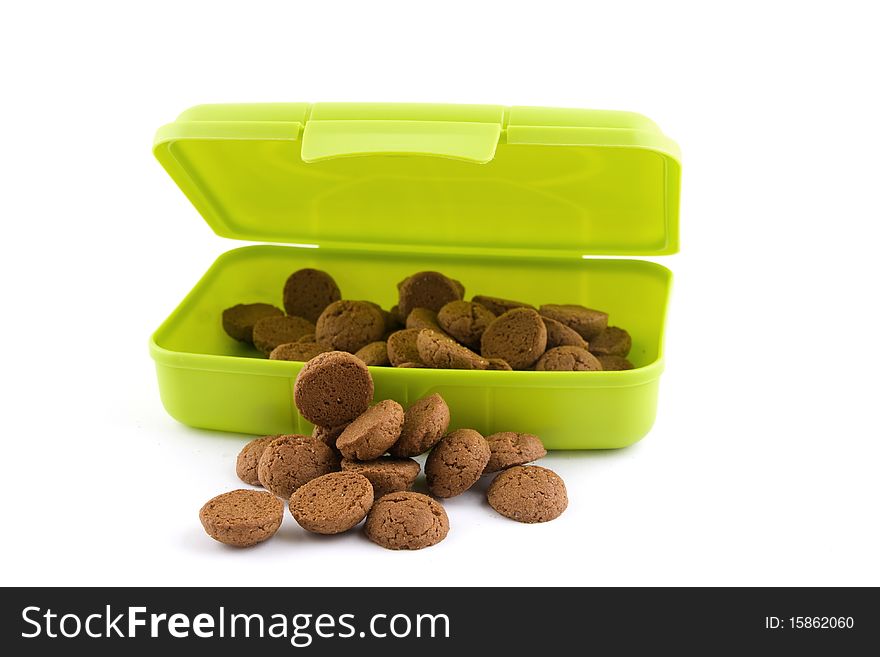 Gingernuts(pepernoten) isolated on white background in a container