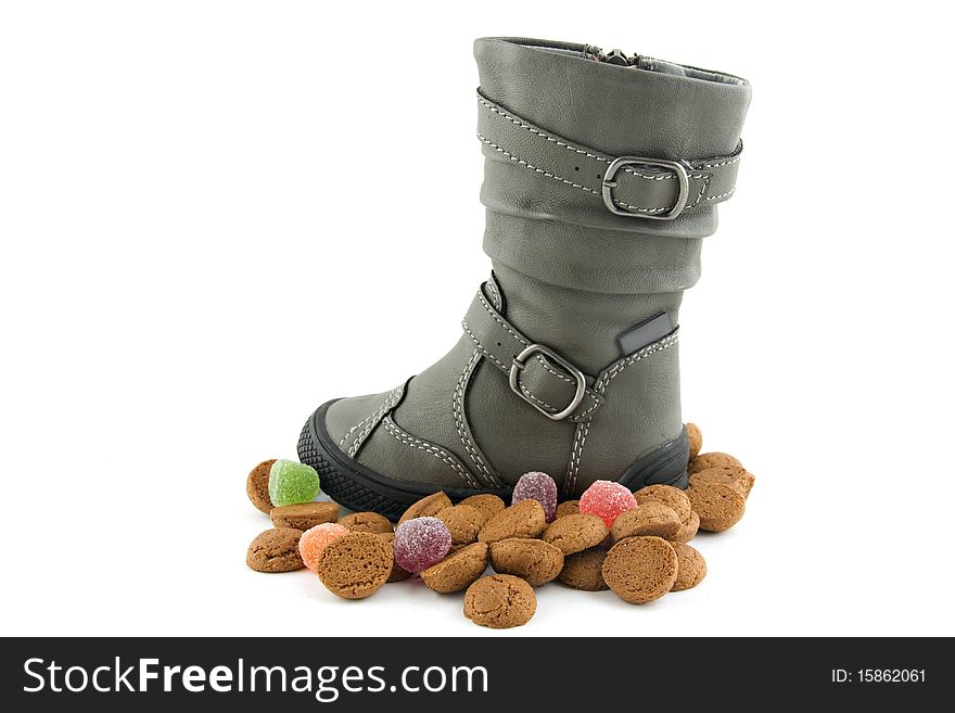 Boots with gingernuts(pepernoten)isolated on a white background. Boots with gingernuts(pepernoten)isolated on a white background