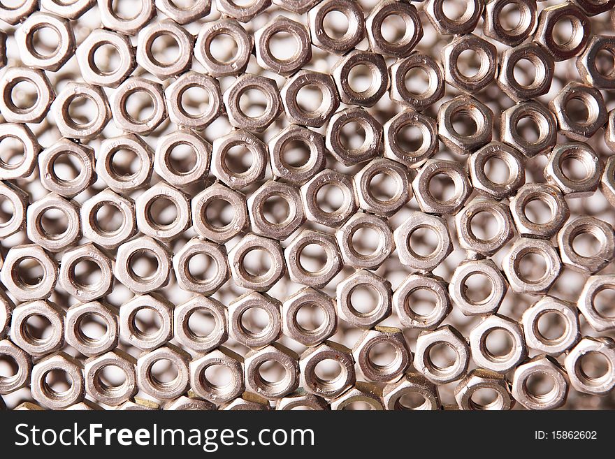 A metal screw-nuts background