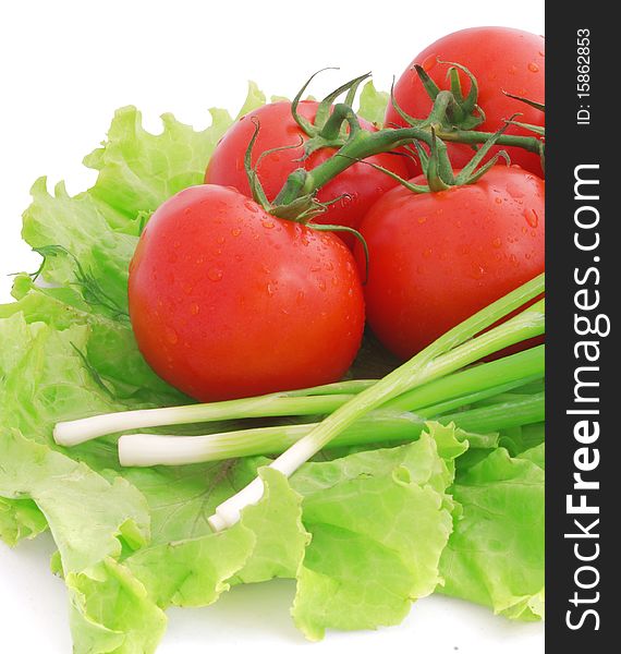 Nice fresh red tomatoes, green lettuce and leek isolated on white. Nice fresh red tomatoes, green lettuce and leek isolated on white