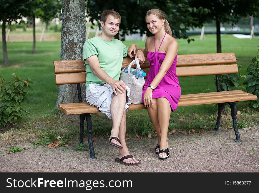 Young couple is relaxing in park. Young couple is relaxing in park