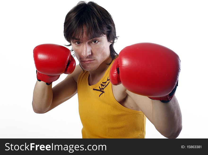 Studio portrait of a boxer with red gloves isolated on white. Studio portrait of a boxer with red gloves isolated on white