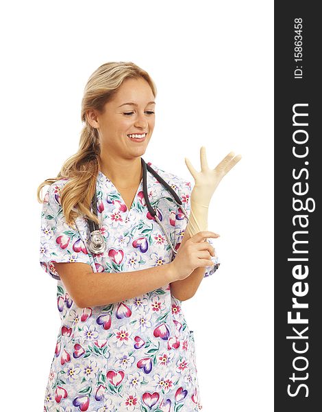 Portrait of young nurse with stethoscope putting on rubber glove