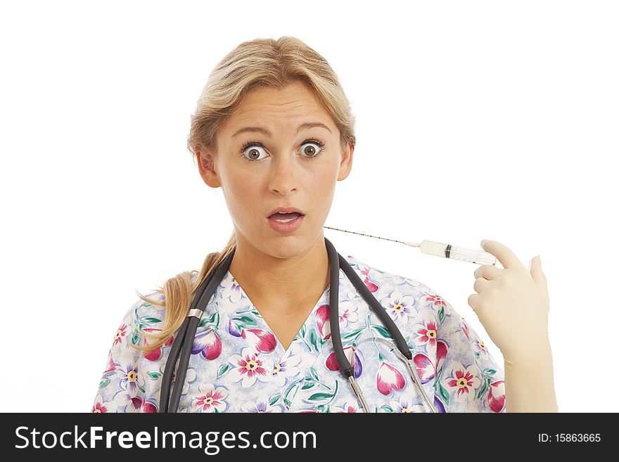 Humorous Portrait of young nurse with stethoscope and syringe