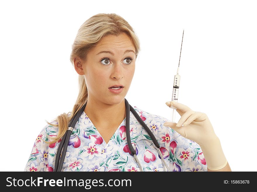 Humorous Portrait of young nurse with stethoscope and syringe