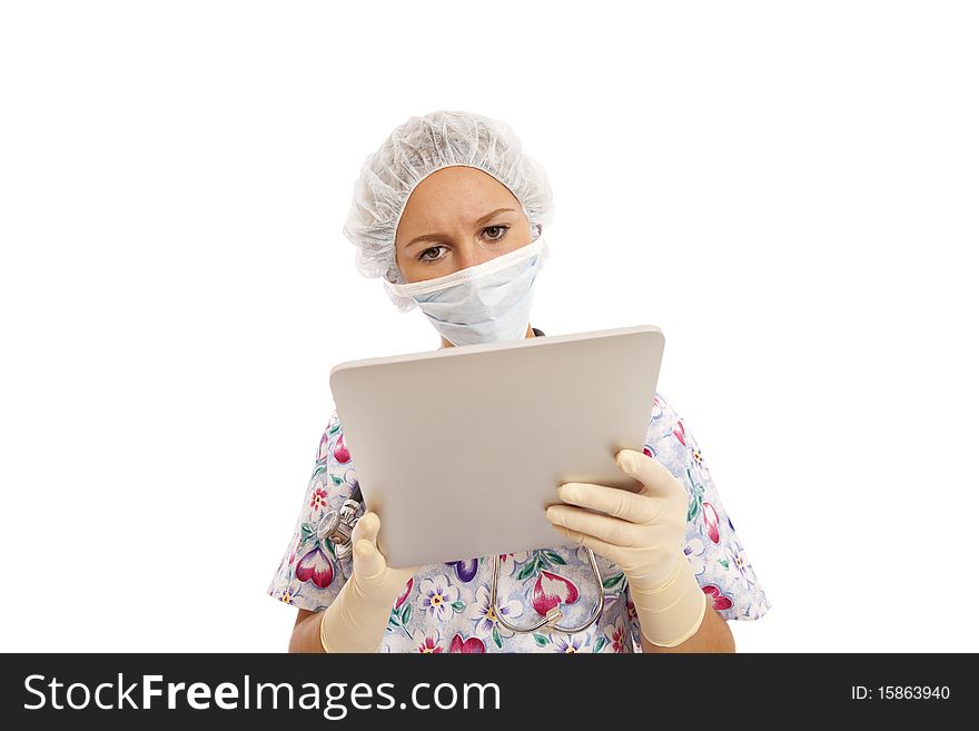 Portrait of young nurse using a touch screen computer. Portrait of young nurse using a touch screen computer