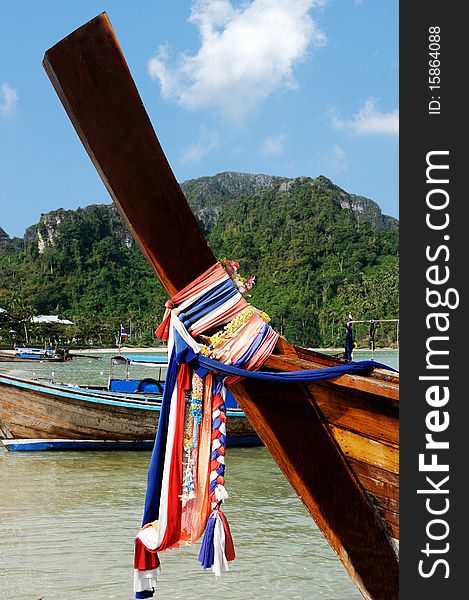 Long-tail boat in the Maya bay of Phi-Phi island. Long-tail boat in the Maya bay of Phi-Phi island