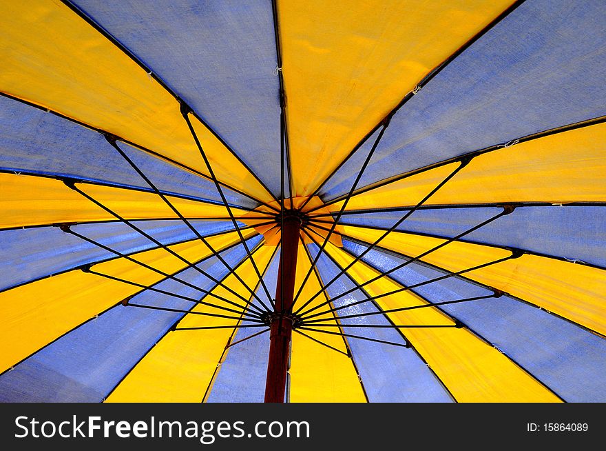 Detail of beach umbrella opposite sun light. Detail of beach umbrella opposite sun light