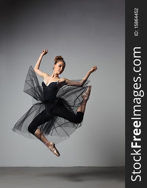 Modern style dancer posing on studio background. Modern style dancer posing on studio background