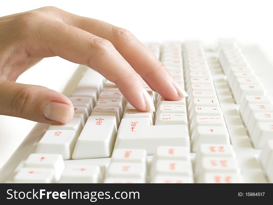 Hand on the computer keyboard isolated on white