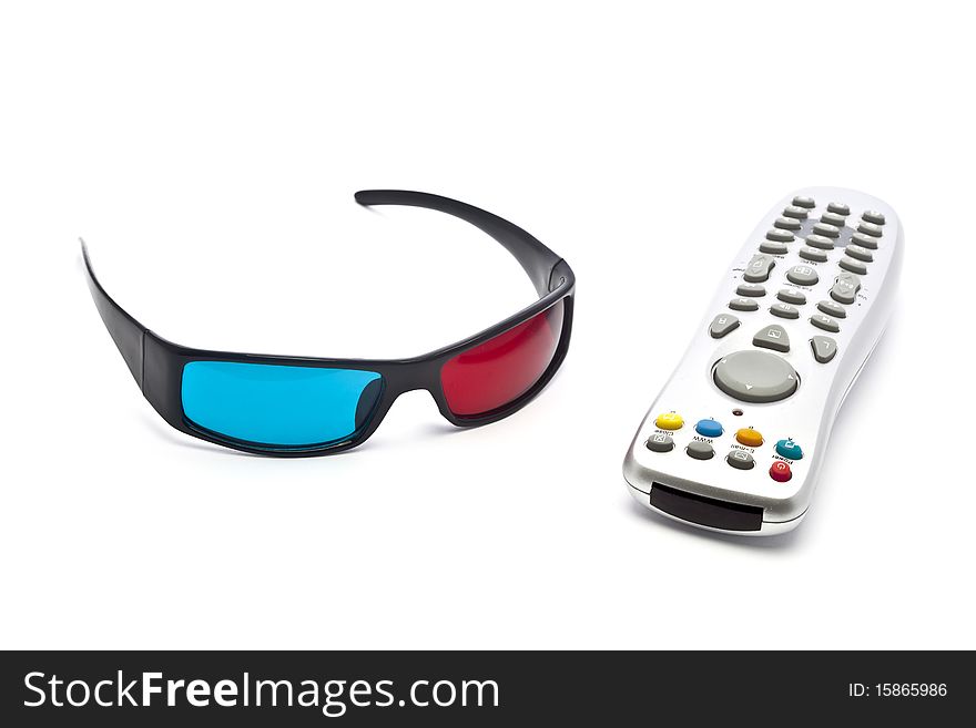 A pair of anaglyph 3D glasses and remote control on a white background. A pair of anaglyph 3D glasses and remote control on a white background.