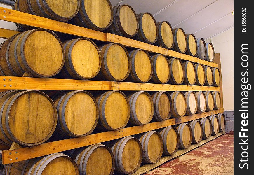 Wooden wine barrels waiting for bottling