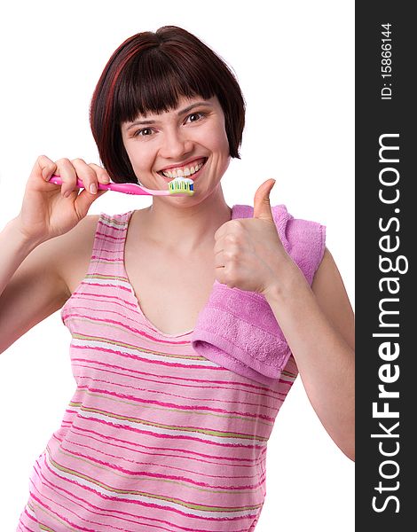 Beautiful girl holding up a toothbrush that contains tooth paste..Young Woman cleaning her teeth..