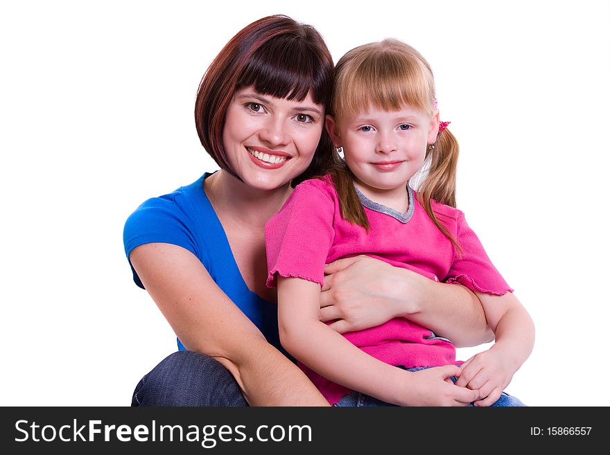 Portrait of a smiling mother and daughter. Woman and girl.