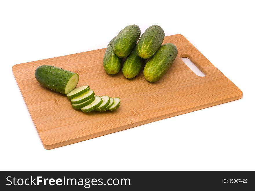 Fresh cucumbers on a chopping board