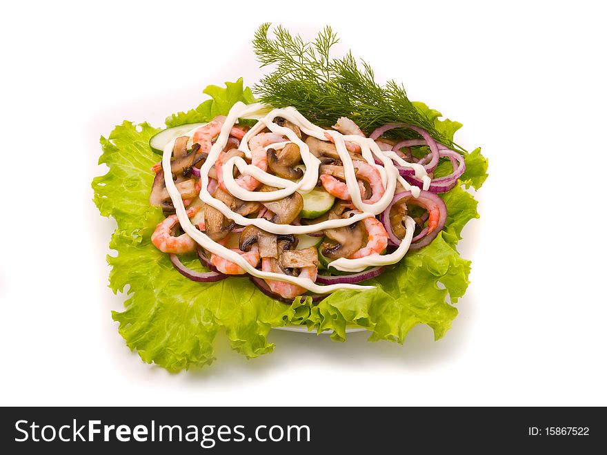 Salad from shrimps with field mushrooms, apples and cucumbers.