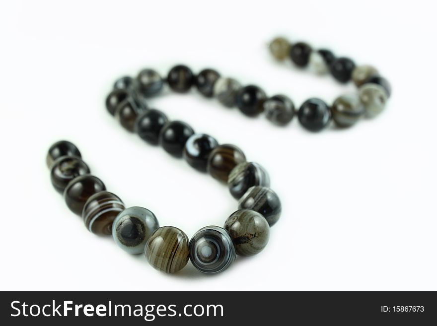 Stone beads on a white background
