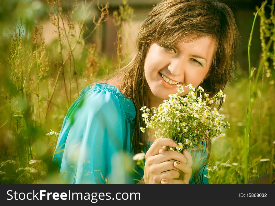 Girl Sitting In A Field