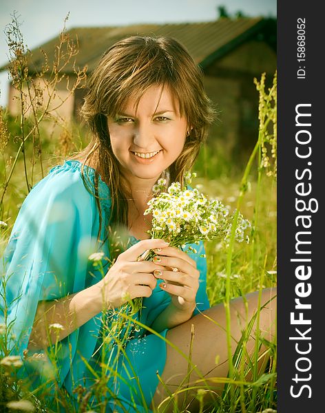 Girl Sitting In A Field