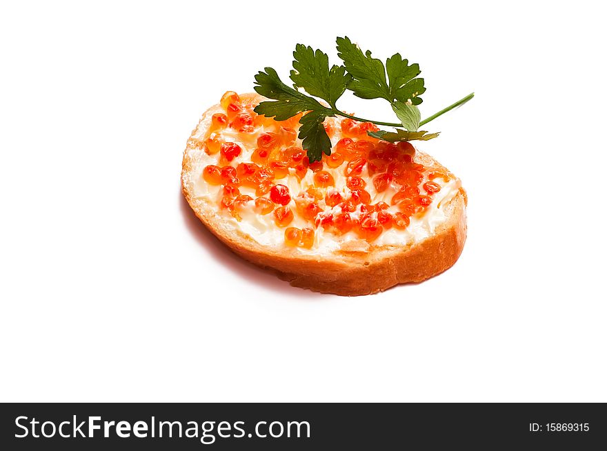 The sandwich with caviar lies on a white background