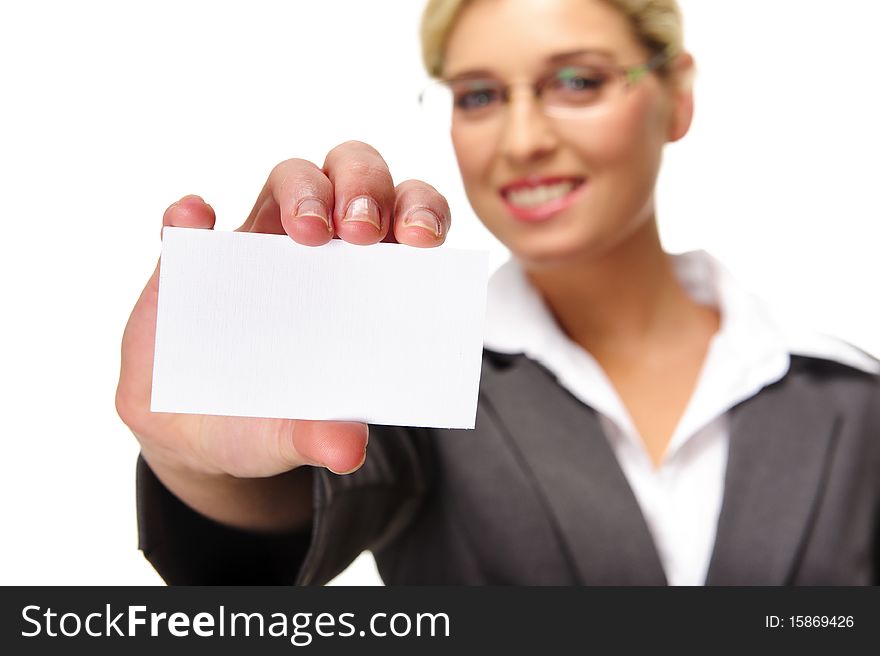 Blonde businesswoman shows her card to the camera, selective focus on business card.