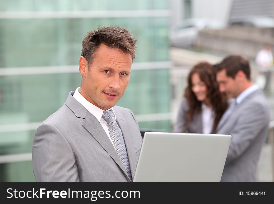 Portrait Of Businessman With Laptop Computer