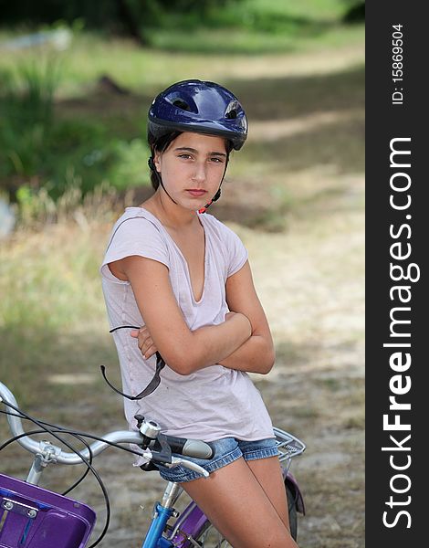 Girl sitting on a bicycle. Girl sitting on a bicycle