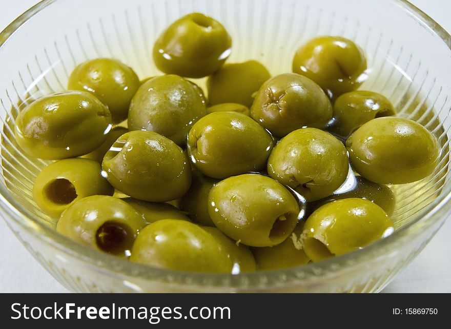 A dish with green olives