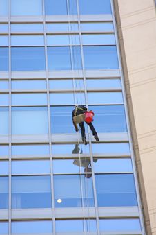 Window Washer And A Glass Wall Stock Images
