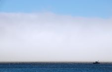 Fog Bank And Commercial Fishing Boat Stock Photos