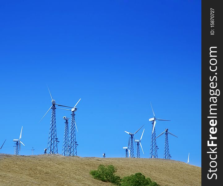 Mountain landscape with wind turbines. Alternative energy.