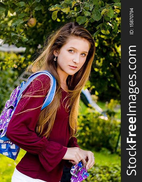 Back to school fashion girl showing bags and accessories