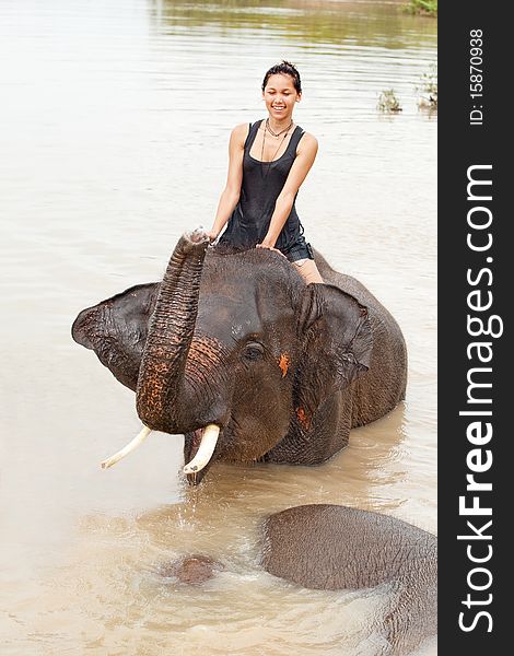 Girl has bath with elephant