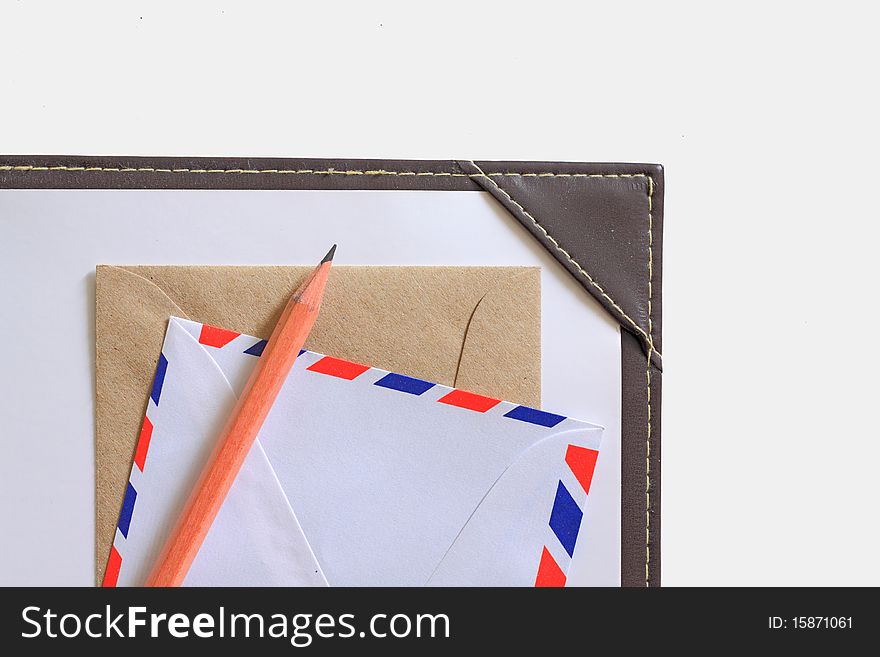 Letter paper, envelope and a wooden pencil isolated in white. Letter paper, envelope and a wooden pencil isolated in white.