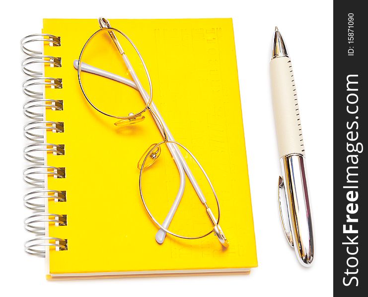 Pen and eye glasses on the page